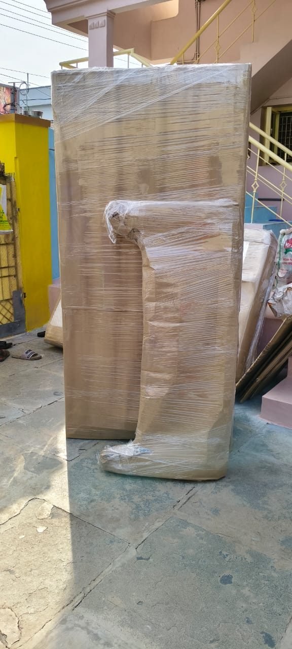 Furniture wrapped for safe household shifting by Sai Surya Packers & Movers