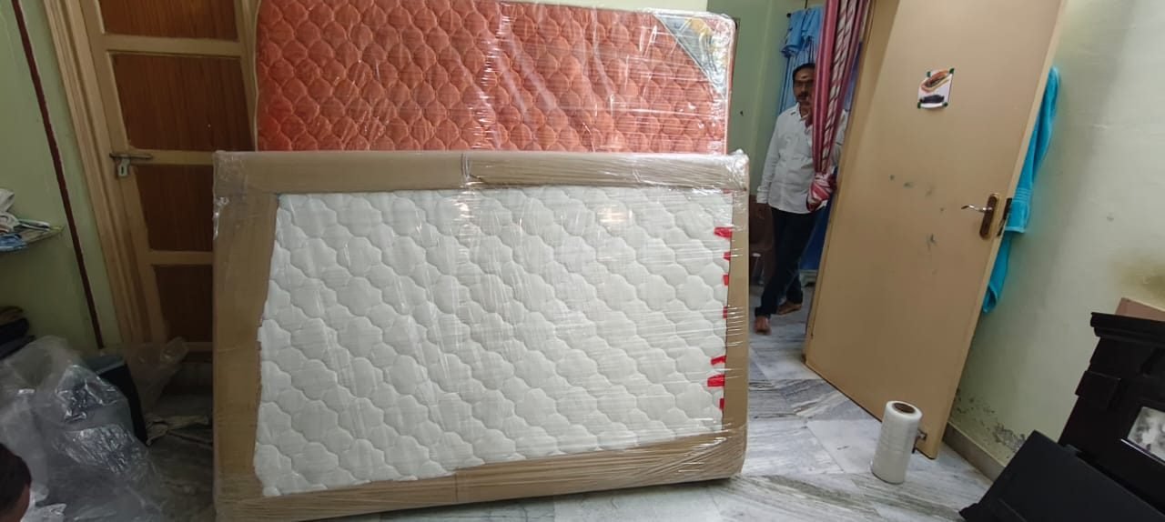 Large household item wrapped for moving
